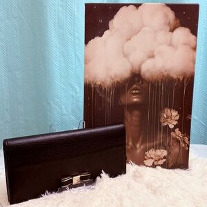 Furla Black Leather Clutch with Gold Bow Accent